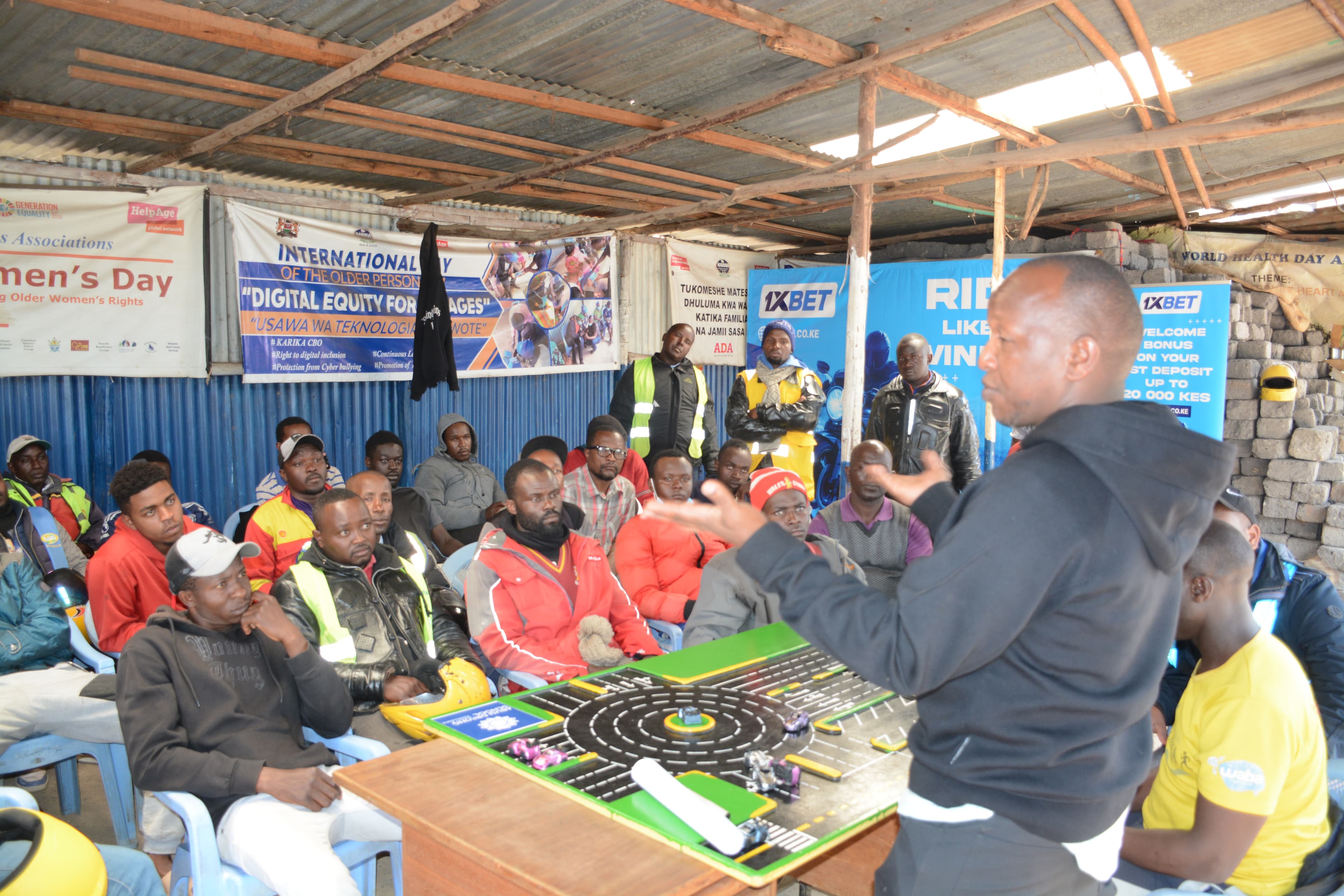 ARUSi Driving School classroom instruction with road signs and training aids.